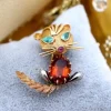 Best Pamono Cat Shaped Gold Brooch with Diamond and Emerald Chips