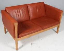 Hot Pamono Danish Two-Seat Sofa in Leather and Oak by Hans J. Wegner, 1960s