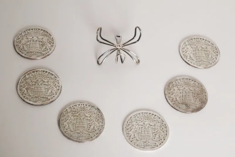 Pamono Glass Hamburg State Coat of Arms Coasters in Sterling Silver, 1960s, Set of 7> Dinnerware Accessories