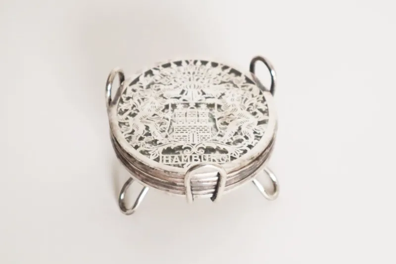 Pamono Glass Hamburg State Coat of Arms Coasters in Sterling Silver, 1960s, Set of 7> Dinnerware Accessories