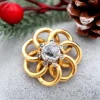 Pamono Gold Brooch with Intertwined Bows and Diamond