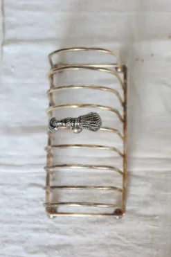 Pamono Large Vintage Silver Metal Toast Rack with Curtain Bow Detail and Tray, 1970s, Set of 2> Dinnerware Accessories