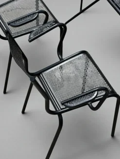Pamono Perforated Metal Armchairs and Table in the style of Mathieu Matégot, 1950s, Set of 7