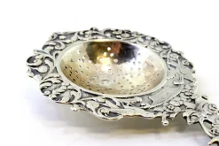 Hot Pamono Silver Tea Strainer with Reliefs, Applications and Caravel Cut-Out Handle