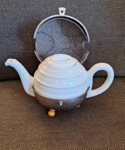 New Pamono Vintage Art Deco German Cream-white Porcelain Spherical Teapot with Silver-Plated Thermal Jacket and Yellow-Brown Bakelite Feet from WMF, 1940s