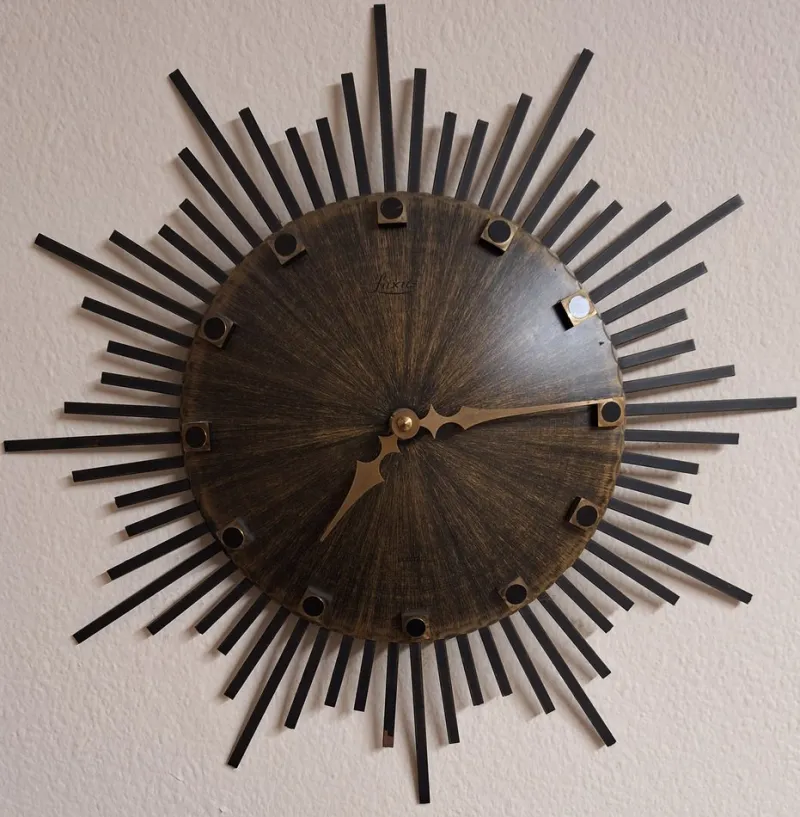 Pamono Vintage Wall Clock Sunburst with Brown Dial and Black Metal Rays from Luxus, 1970s> Watches