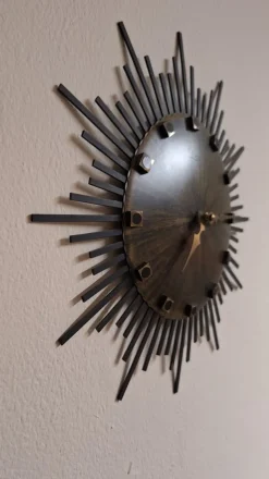 Pamono Vintage Wall Clock Sunburst with Brown Dial and Black Metal Rays from Luxus, 1970s> Watches