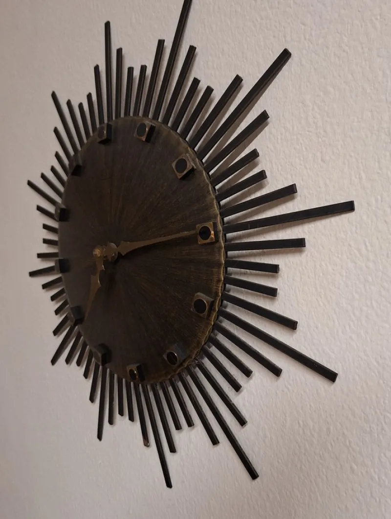 Pamono Vintage Wall Clock Sunburst with Brown Dial and Black Metal Rays from Luxus, 1970s> Watches